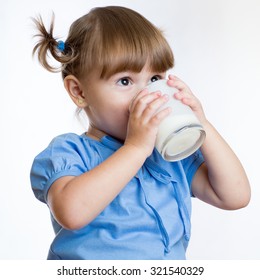 Kid Girl Drinking Milk Or Yogurt From Glass