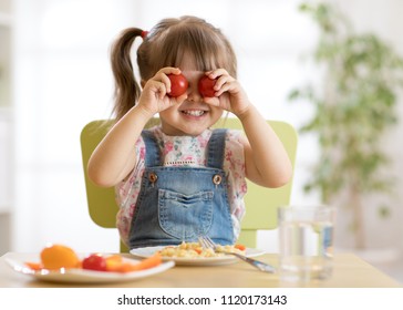 kid girl having fun with food vegetables at nursery room - Shutterstock ID 1120173143