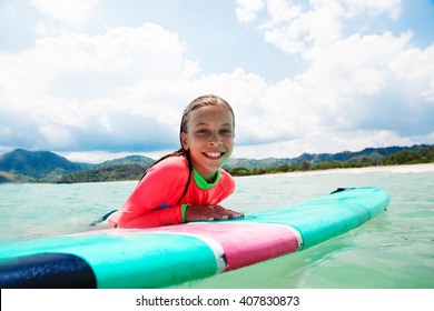 Kid girl is learning surfing - Powered by Shutterstock