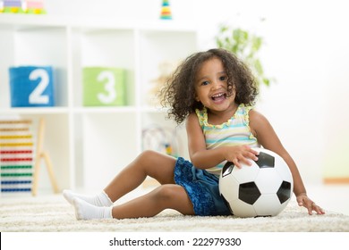 Kid girl playing toys at home or kindergarten