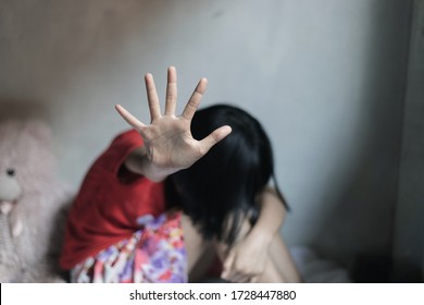 Kid girl showing hand signaling to stop useful to campaign against violence and pain. Stop abusing violence. violence, terrified , A fearful child, human rights day concept. copy space