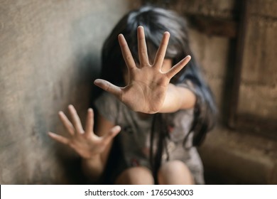 Kid girl showing hand signaling to stop useful to campaign against violence and pain. Stop abusing violence. violence, terrified , A fearful child, human rights day concept. copy space