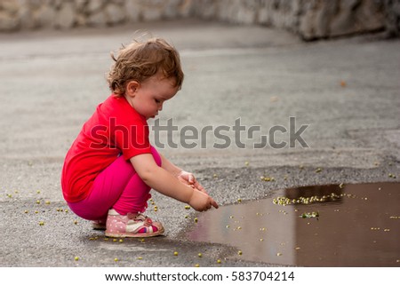 Similar – Foto Bild Baby spielt am Strand.