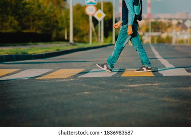kid going to school, boy with backpack crossing the road
