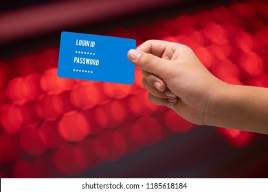 A Kid Hand Holding Blank Credit Or Debit Card On Red Light Bokeh Backgrounds And Light Leak Effect. 