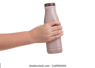 Kid Hand Holding Bottle Of Fresh Milk Chocolate Isolated On White Background.