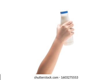 Kid Hand Holding Bottle Of Fresh Milk  Isolated On White Background.