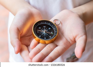 Kid Hand Holding Compass, Copy Space