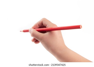 Kid Hand Holding Pencil, Writing Or Drawing, Isolated On White Background.