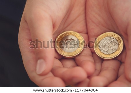 kid hand showing money two pound stock photo edit now 1177044904