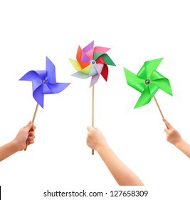 Kid Hands Holding Colorful Pinwheel Close Up Isolated On White Background.