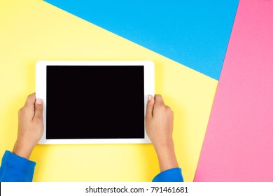 Kid Hands With Tablet Computer On Colorful Background