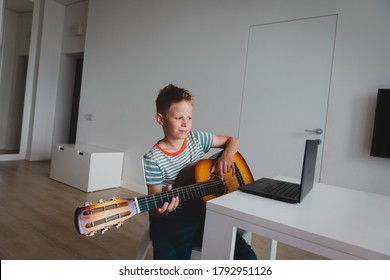 Kid Having Guitar Lesson Online, Remote Music Class