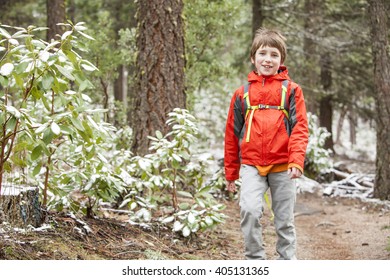 A Kid Hiking In The Snow