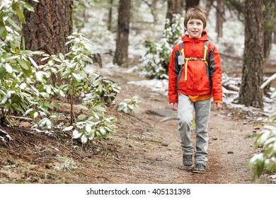 A Kid Hiking In The Snow