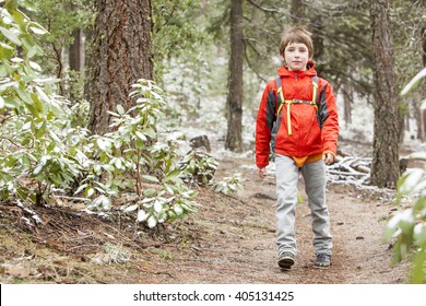 A Kid Hiking In The Snow