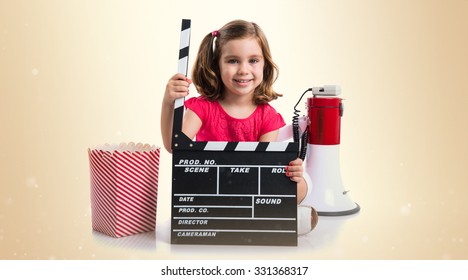 Kid holding a clapperboard