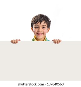 Kid Holding Empty Placard Over White Background 