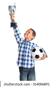 Kid Holding A Football Trophy 