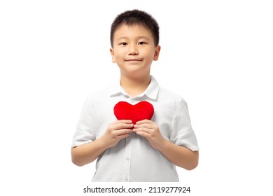 Kid Holding Heart On His Chest With Smile, Wearing White Shirt Isolated On White Background