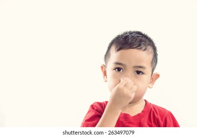 Kid Holding His Nose