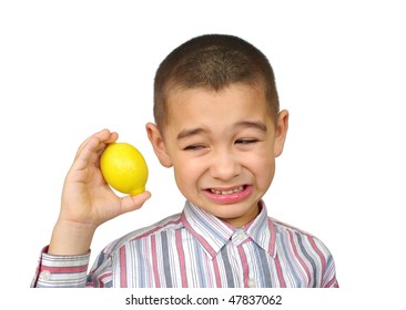 Kid Holding A Lemon And Making A Funny Face, Six Years Old