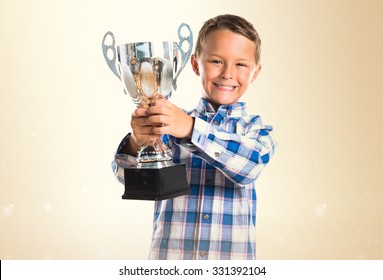 Kid Holding A Trophy 