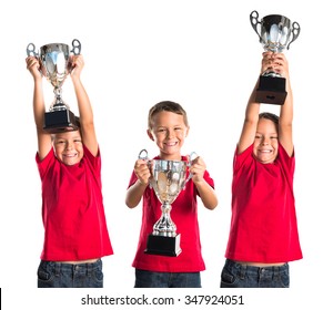 Kid Holding A Trophy