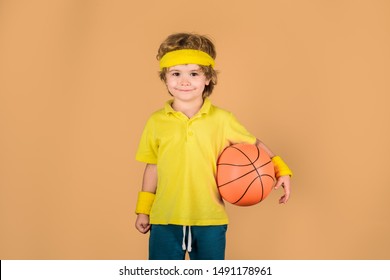 Kid Holds Basketball. Basketball Player. Sport Active. Sporty Boy With Ball. Boy In Sportswear. Hobby Sport Concept. Sport, Fitness, Healthy Lifestyle. Sport For Children. Kid Playing With Basketball.