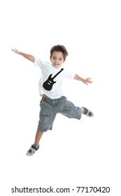 A Kid Jumping In The Air, With A Nice Tshirt With A Guitar Painted On It. Isolated On White.