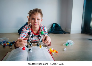 kid learning chemistry, making model of a molecule, STEM - Shutterstock ID 1660845232