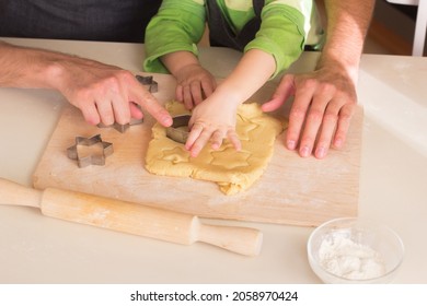 Kid Learning How To Cook In A Cooking Class Together With Father. Daddy And Me Handmade Christmas Dessert. Family Making Cookie, Hands Using Rolling Pin