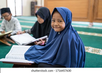 Kid Learning To Read Quran With Muslim Teacher Or Ustad