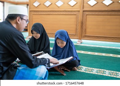 Kid Learning To Read Quran With Muslim Teacher Or Ustad