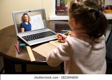 Kid Learning With Teacher By Laptop In Room. Online Home Education, Tutor Teaches Child During Quarantine Due To COVID-19. Concept Of Virtual Distance Lesson And Elearning Study Technology.