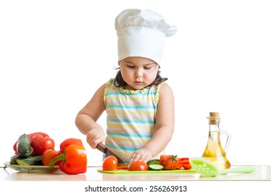 Kid Little Girl Helping At Kitchen With Salad Making