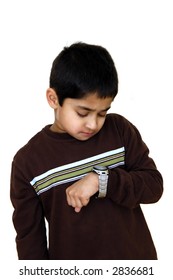 A Kid Looking At His Wrist Watch