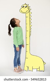 Kid Looking Up At A Tall Paper Dinosaur