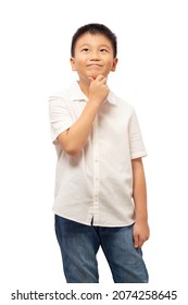 Kid Looking Up And Thinking With Hand On Chin Isolated On White Background