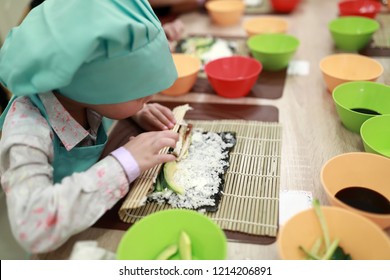 Kid Is Making Sushi At Cooking Class