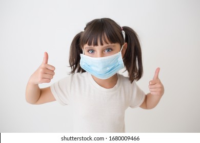 Kid With Medical Face Mask Doing Thumbs Up