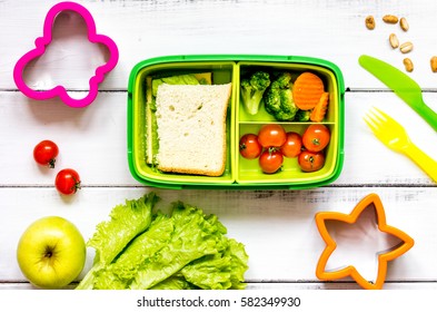 Kid Menu Lunchbox For School Top View On Wooden Background