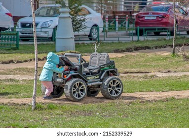 The Kid Opened The Hood Of The Car And Looks At What Is There On May 2, 2022 Moscow