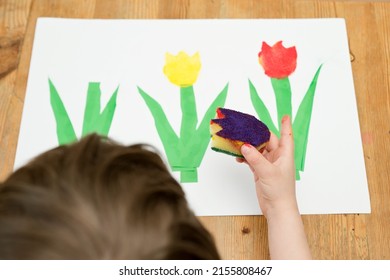 Kid painting and gouache spring flower  Boy produces colored tulips for mommy  Children's activities  easy ideas for children at home  Art lessons at home  DIY tasks for children  Early education 