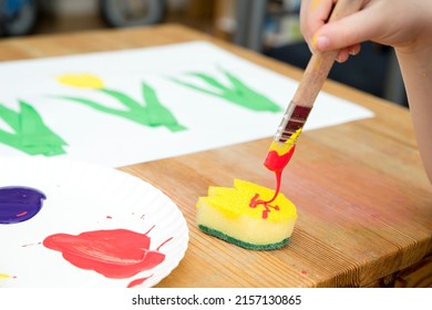 Kid painting and gouache spring flower  Boy produces colored tulips for mommy  Children's activities  easy ideas for children at home  Art lessons at home  DIY tasks for children  Early education 