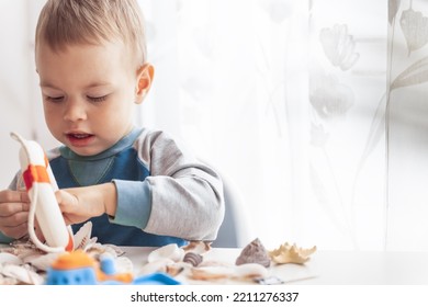 Kid Play With Lifebuoy And Starfish. Child Play With Sea Shells And Boats. Summer Vacation And Travel Concept