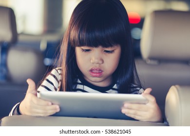 Kid Play Tablet In Car