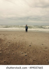 Kid Playing In A Beach In Denmark