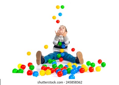 Kid Playing With Colored Balls