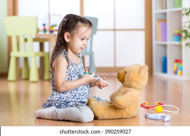 Kid Playing A Doctor In Children Room